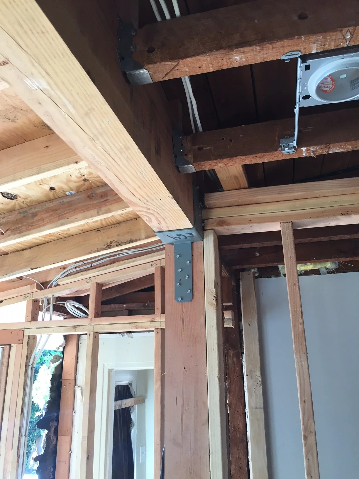  This new beam allowed us to remove a wall and really open up this kitchen remodel, both in terms of size and flexibility. 
