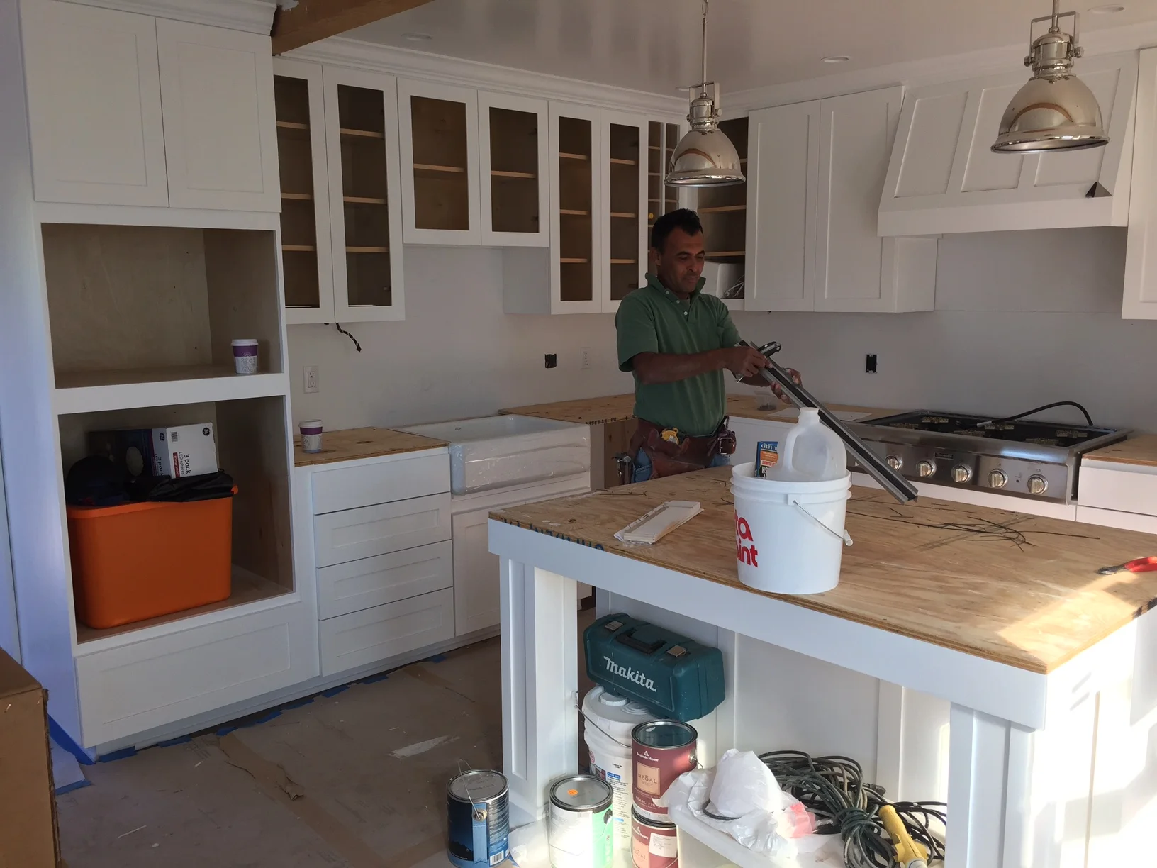  Hilario installing the rough-tops for the new counters. 