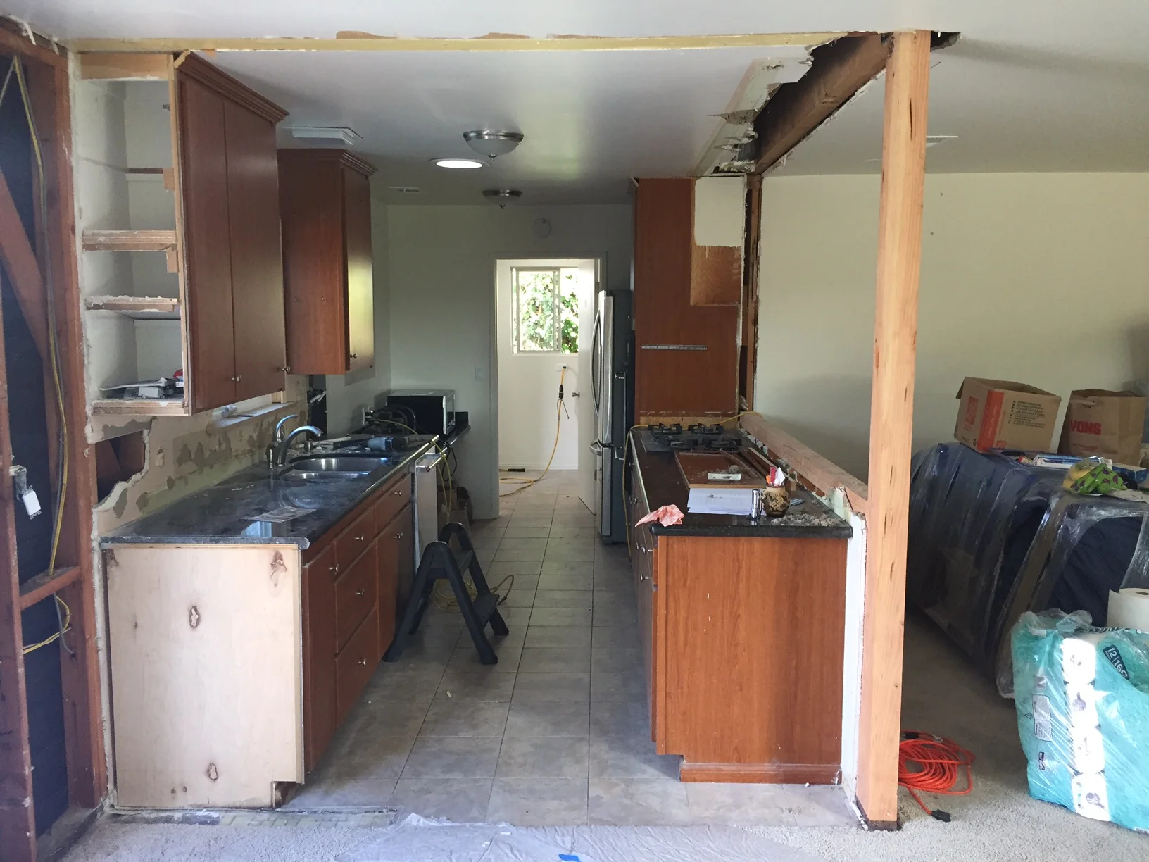  Existing kitchen cabinets undergoing demotion. 