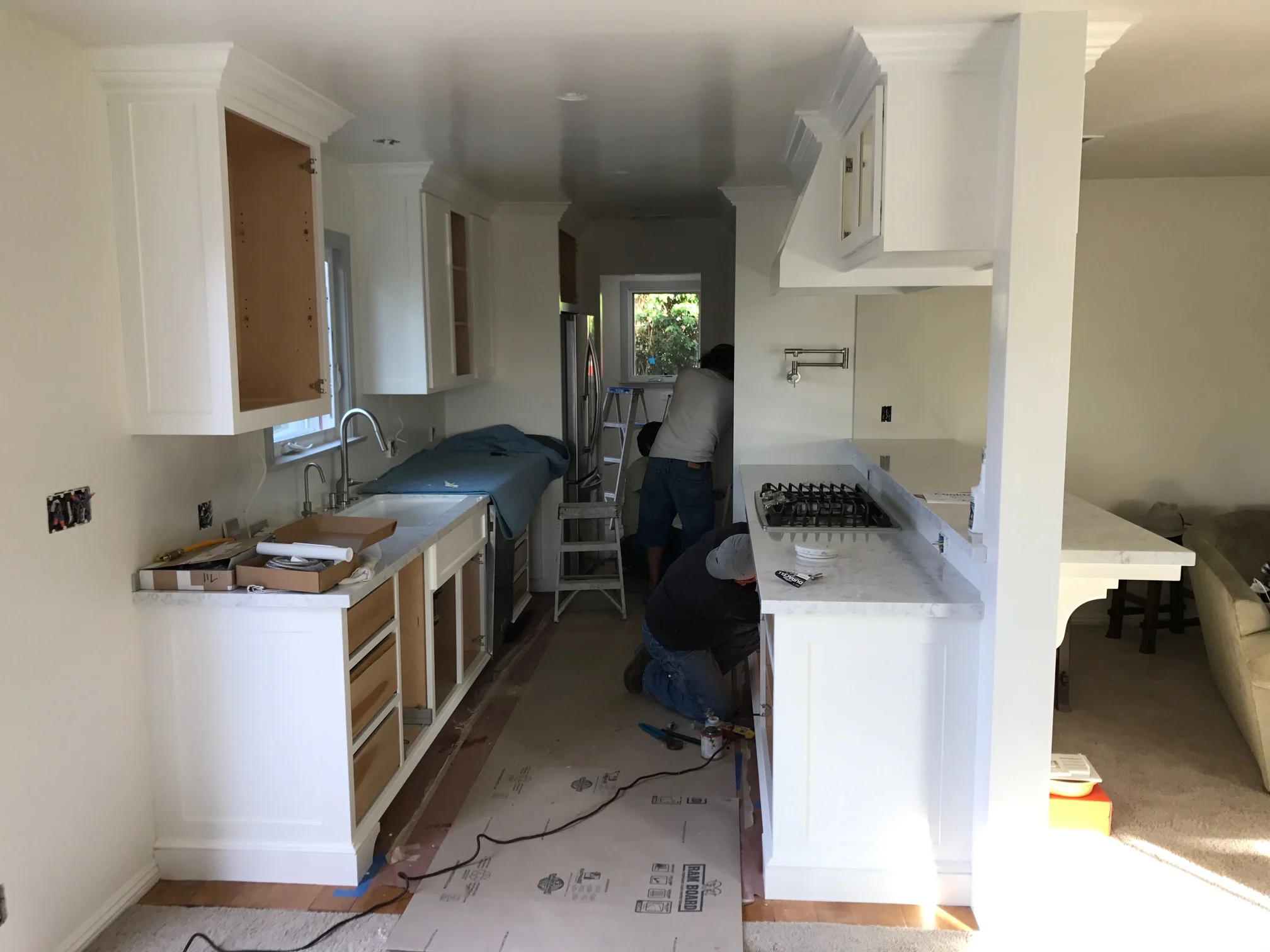    2/13. &nbsp;Cabinet doors are finish painted and getting installed along with the interior pull-out drawers. &nbsp;The appliances also began getting put in today, with the refrigerator, dishwasher, sink fixtures, and cook top installed with more t