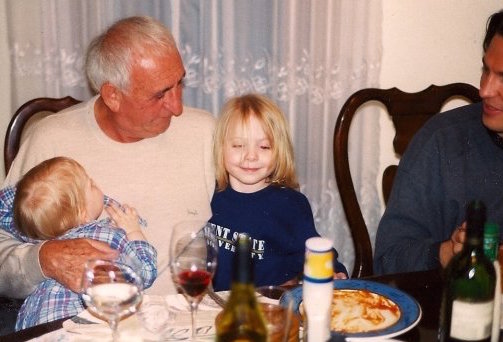 Ray Federman gently tells an after dinner story to tiny Quentin Joyce and Anna Livia. "If a word does not exist," he tells them, "you can invent it."