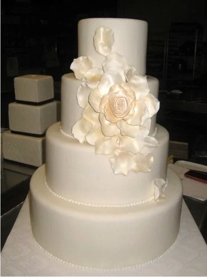White wedding cake with custom sugar flowers