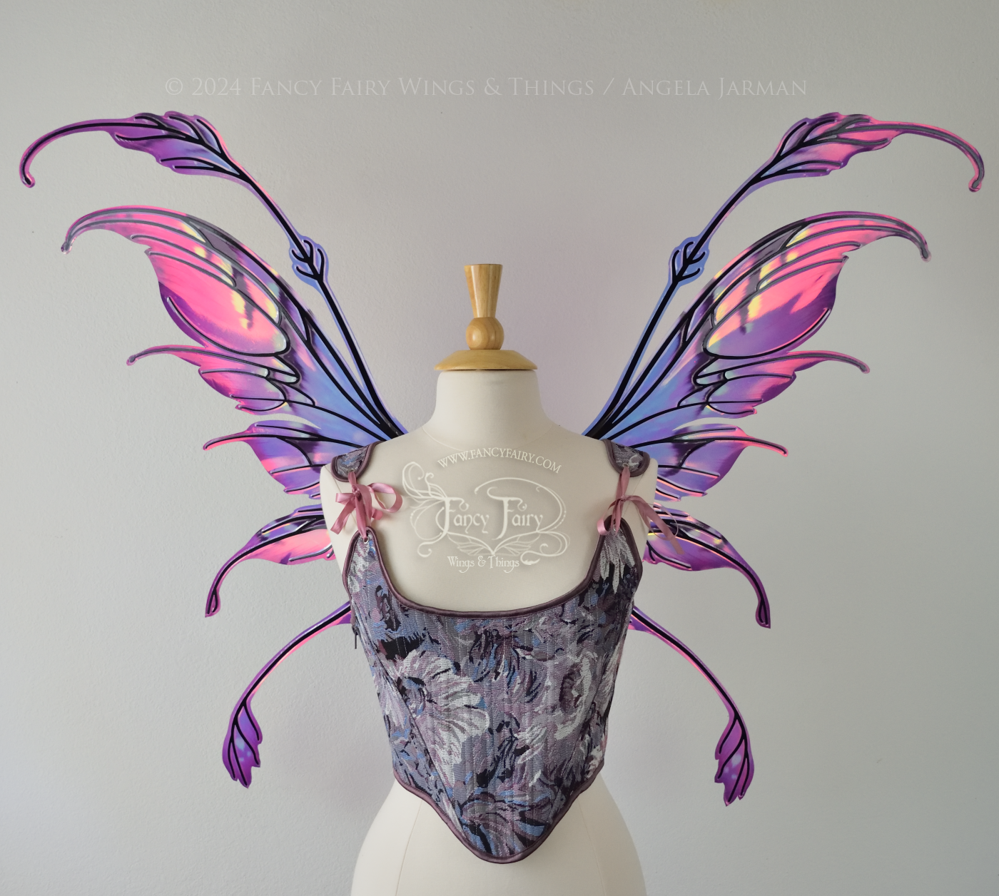 Iridescent magenta & purple iridescent fairy wings with antennae & tails, worn on a dress form, front view