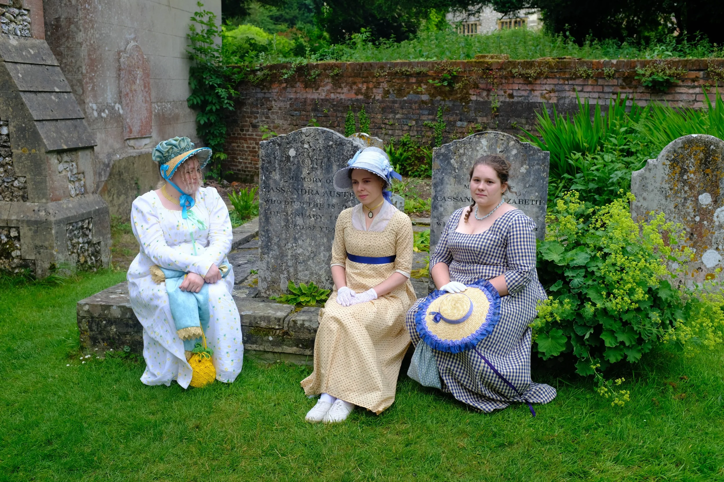 Three ladies at the gravestones of Jane's mother and sister