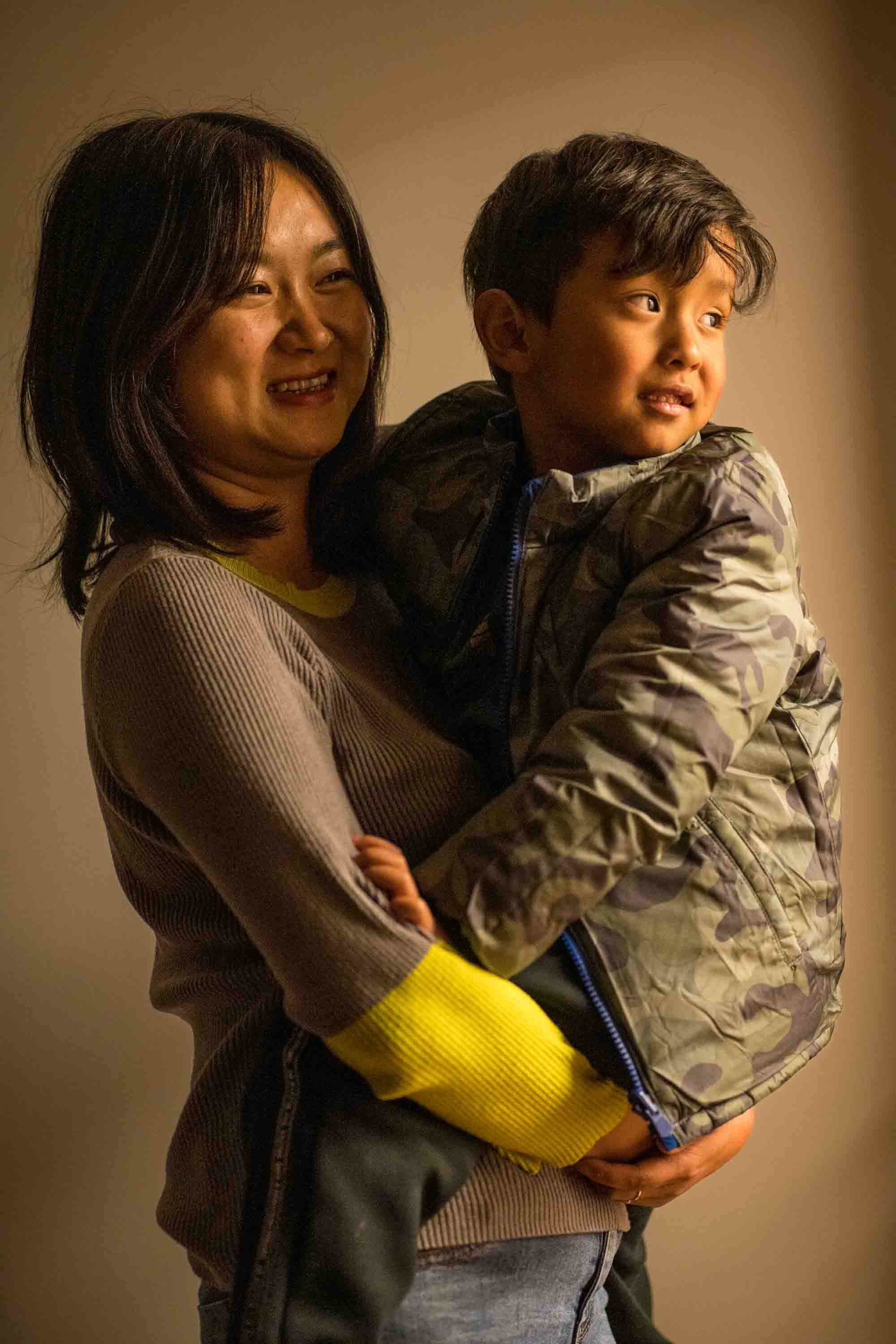  Steph and her son in their apartment in Kunming, Yunnan province,  China.Steph has been raised her son by herself. Since she has been divorced. 