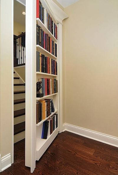 Creating what looks like a secret door to a loft conversion or another part of the house would bring an element of mystery (and extra storage space for books too!)