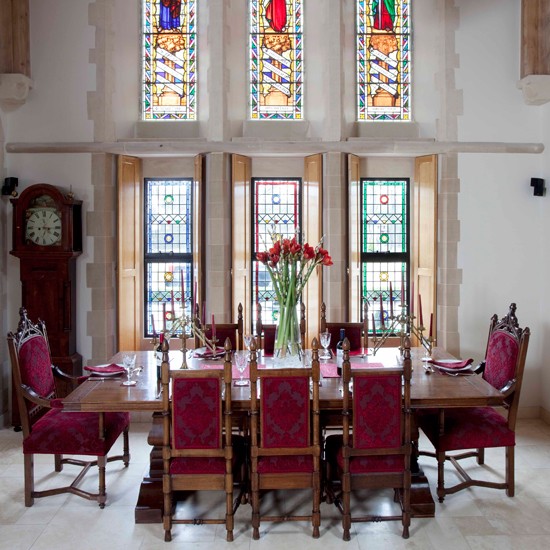 The choice of furniture for this dining room blend well with this former church.