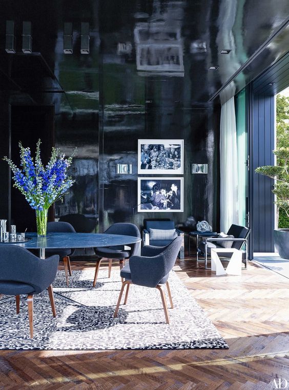 A high gloss ceiling will make your room feel as though it's endless. 