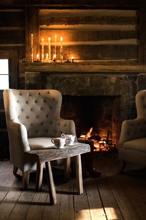 Two armchairs in front of the fire, in a corner of the room lit only by candles, encourages warm, relaxed conversations in the evening.