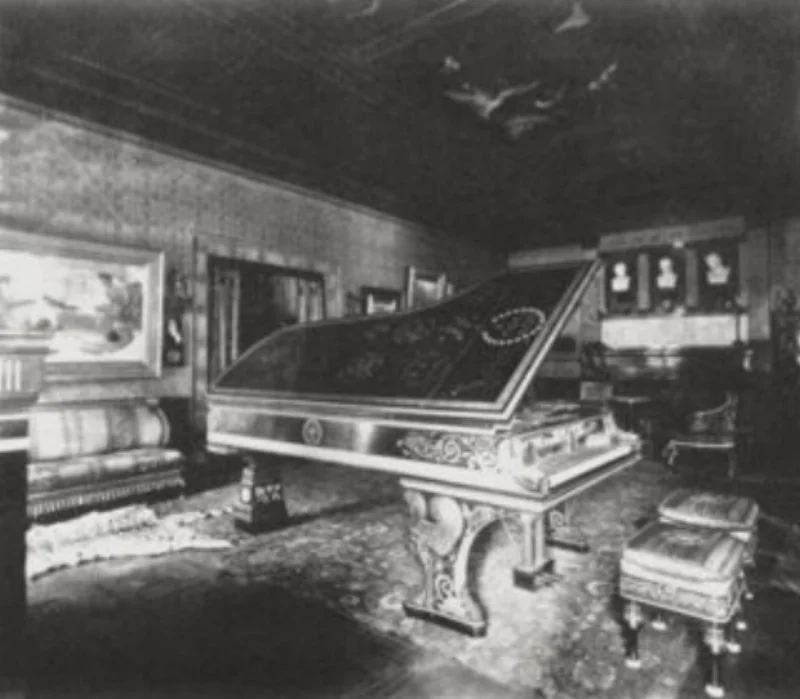 This Greek-style music room was commissioned in 1884 by American art collector Henry Gurdon Marquand for his New York house. The ceiling was decorated with paintings of the Greek muses and Greek and Roman vases and statues were displayed around the room.The suite of furniture was richly embellished with Greek motifs and was much admired in London before being shipped to America. The room also held one of the largest pianos in New York City.
