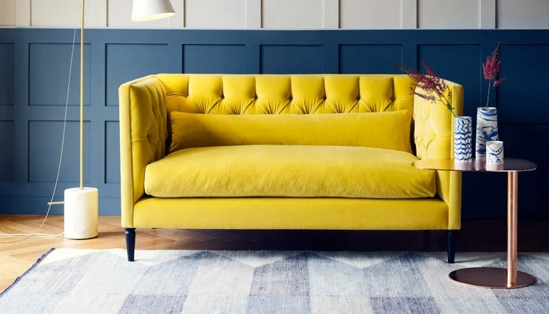 Rich yellow velvet... wow! A bold choice, but oh so inviting, especially when teamed with dark walls and neutral accessories. The sumptuous Balmoral sofa from Heal's will be a pop of sunshine during even the darkest winter months. A more formal style, with it's tall sides and deep-buttoning, it'll keep it's shape and still look good, even after a marathon of lounging.