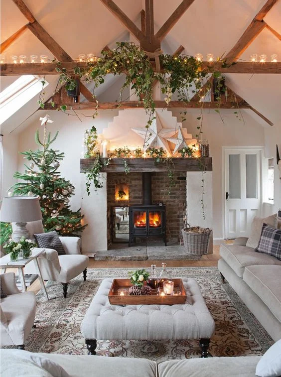 Peaking round the door you'll see a fire in the grate, the trails of ivy hanging down and the promise of soft sofas and deep cushions. There's even a warming Christmas drink ready and waiting! Transform your home into a woodland inspired wonderland. Candles, a fire (if possible), but most importantly adding natural elements and creating a welcoming sight filled with cosy furniture and thoughtful decorative touches. . Source: indeeddecor.com