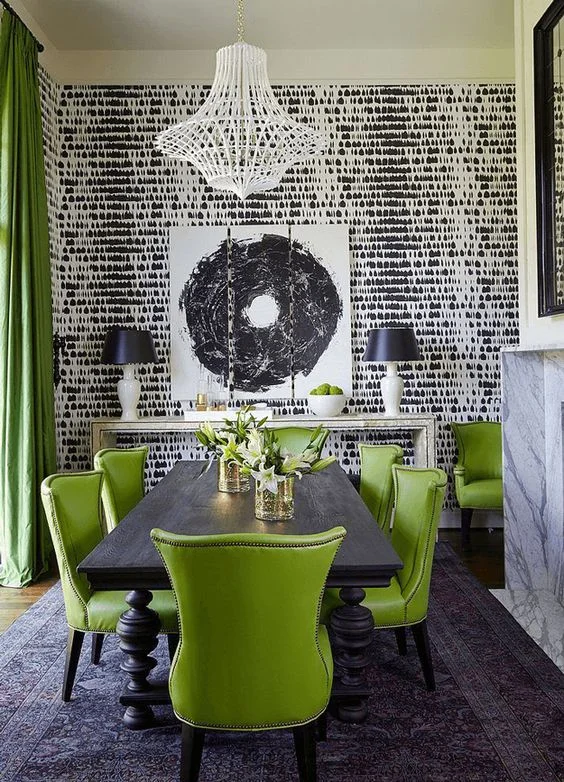 In this dining room, the vibrant green is matched by a strong monochrome palette in the rest of the room. This is needed to balance the colours and make the room not feel dominated by any one colour. It's modern and yet feels traditional too. You ne…