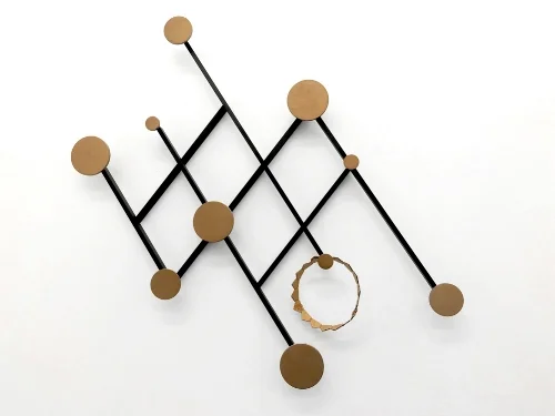 5 ) Memoir Wall Hanger Not just any coat rack, this Art Deco inspired wall hanger looks more like a work of art. But it's practical too and the knobs of different sizes mean it'll be easy to find a place for all your outdoor wear. 