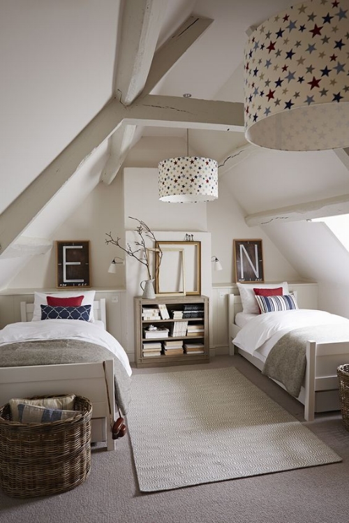 A cosy room for two to share. The different cushions on the bed and letter pictures on the wall above help personalise the areas. I love the touches of colour and the star print lamp shades bring everything together. Photo: simshilditch.com