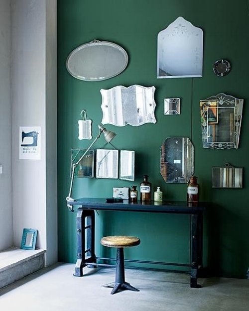 The colour of this wall is lovely and provides a wonderful backdrop to this group of mirrors. They're all different but they're rim-less style brings this collection together. Image: remodelista.com