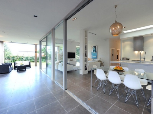 Remove any barriers between the indoors and outdoors by allowing the same flooring to span inside and outside. Make your outside an extension of your home and a room in itself. Image: realestate.com.au