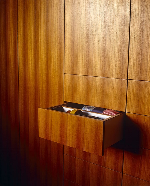 Or conceal your storage in what looks like a wall. It will get rid of your clutter and you could have this beautiful wood to look at each day. Image: design hunter.co.uk