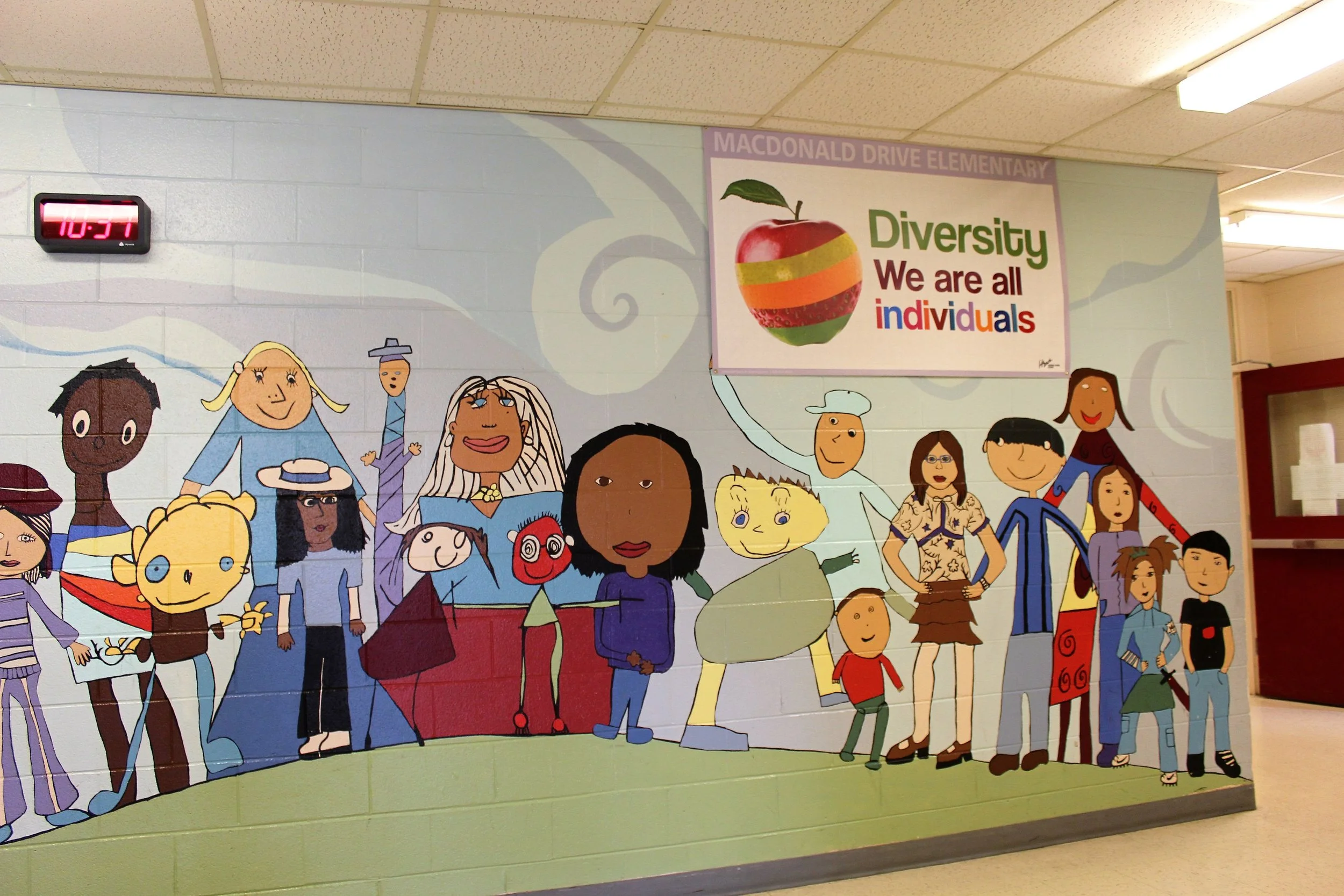 Upon entering our school, all teachers, students, parents, and visitors are immersed in a multicultural atmosphere. The colourful mural of children (painted by previous students) on the wall, along with the poster above it, communicate our appreciation of the diverse cultures in our student population and the world, in general. Discussion generated about the importance and meaning of the words and images was very rich, enlightening, and for many, reaffirming of their individual place within the whole of the school-we all belong. Now every time we walk by, children not only look but realize the meaning and importance of what they are seeing. This activity connects to the foundation of global citizenship as the children are able to see themselves in the images of the mural. They recognize the diversity amongst themselves and were able to connect the variety of student cultures in our one school to the different colours and textures of the peels on the one apple. They also made links to the world, in general. They understand that all of the children are interconnected within our school just like our world is made up of all kinds of cultures and people, just like us. We are all citizens of the school and world, and our diversity makes us special.