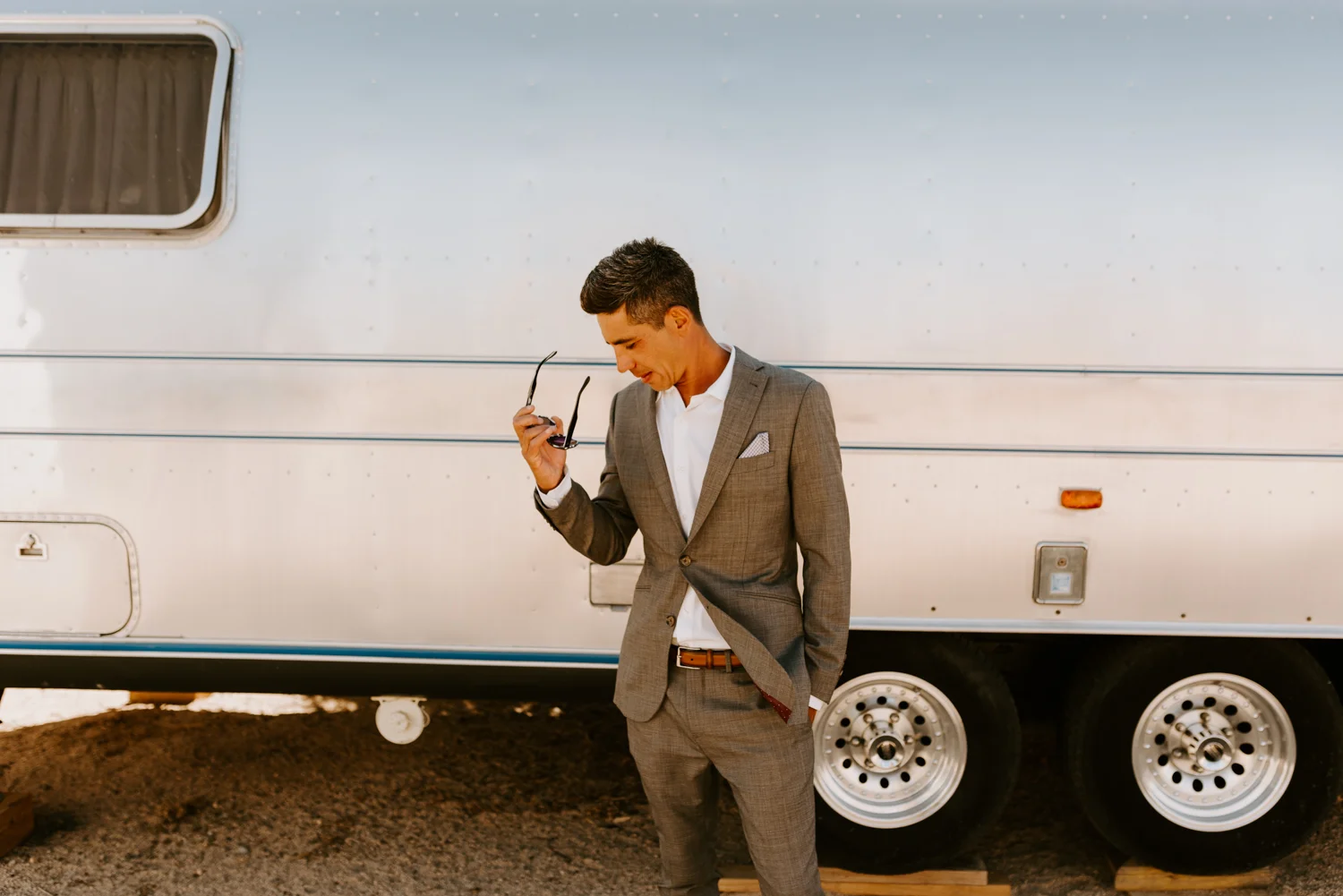 Groom portrait airstream | Le Haut Desert Aerie Wedding | Joshua Tree Wedding Photographer | Tida Svy | www.tidasvy.com