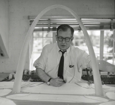 Eero Saarinen with a scale model of what would become the Gateway Arch