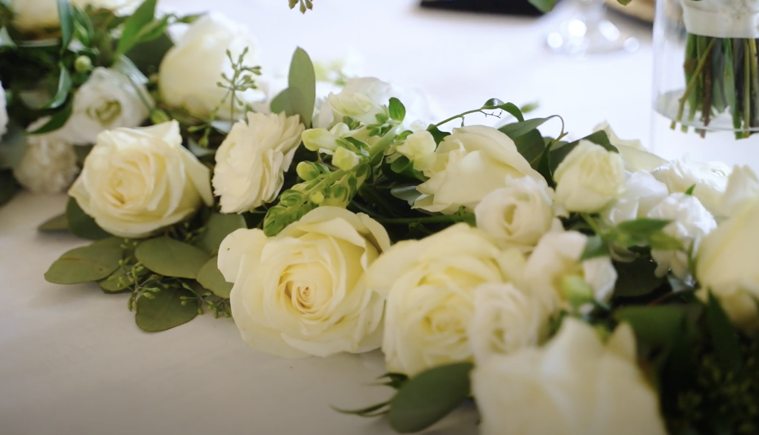 flower arrangement on wedding reception table