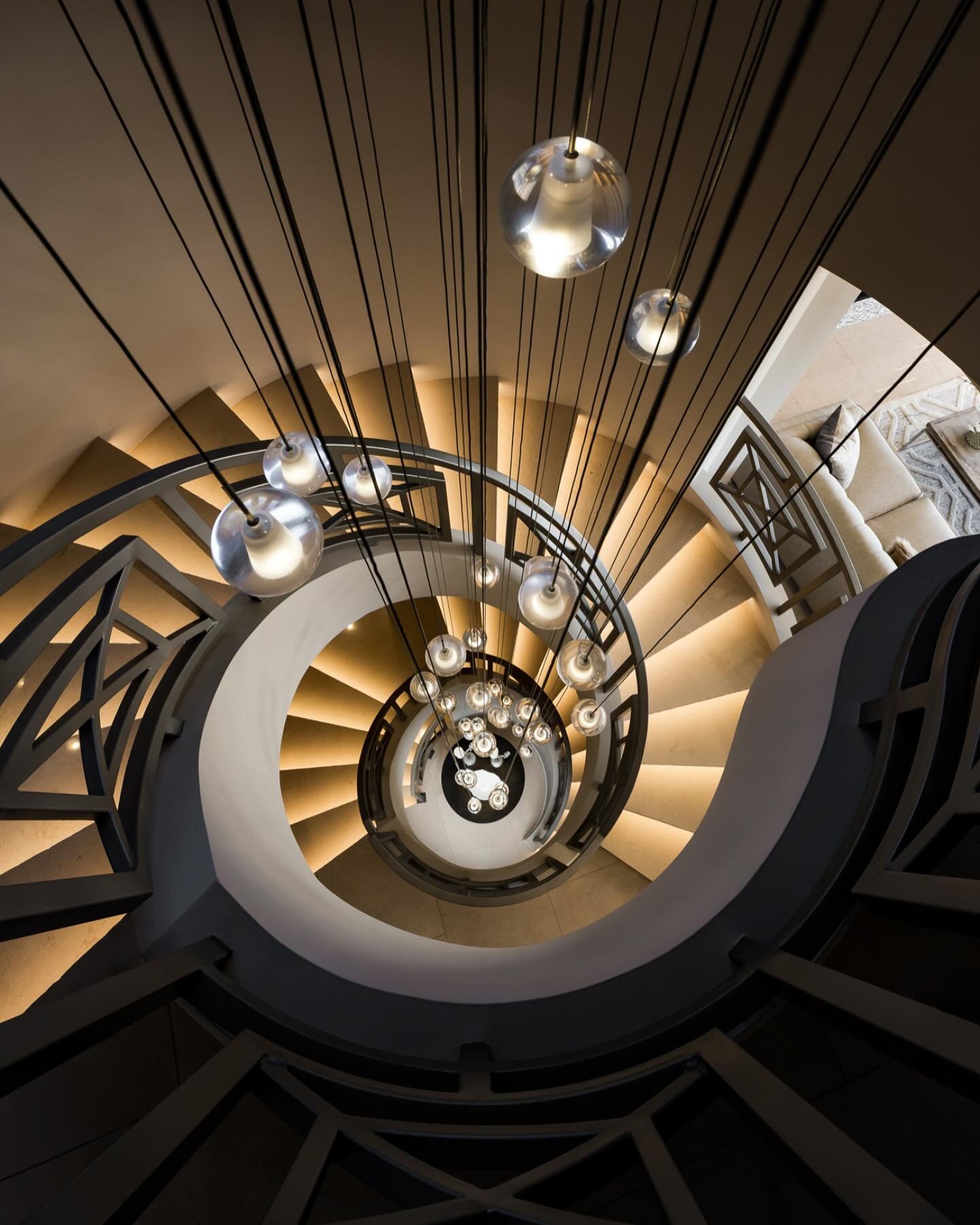 Spiral staircases always make for incredible compositions, but this one takes it to another level. The interplay of light, shadow, and these floating glass pendants creates a sense of movement and depth that makes this shot one of my favorites.

#Arc
