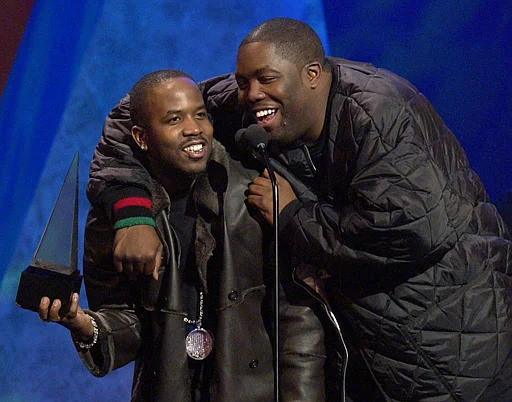 Big Boi with Killer Mike, accepting the award for Favorite Hip-Hop/R&B Band, Duo, or Group on behalf of OutKast at the 30th Annual American Music Awards in 2003.