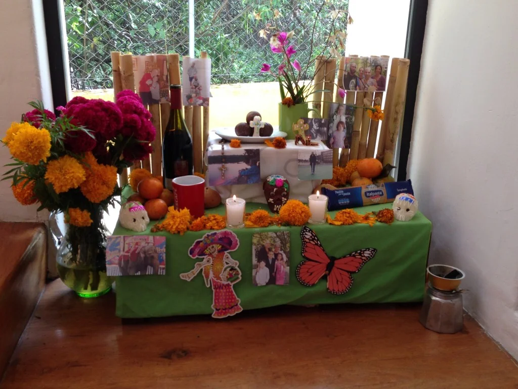 Our family Day of the Dead altar, constructed for Joanne Carlino, Paul's mom. The altar is supposed to be 3 levels with images and items dear to the deceased. (We ignorantly included photos of living people, which we later learned we weren't supposed to do.) Copal , an incense from the resin of the copal tree, is burned on the altar and special sweet foods are placed on the altar, along with marigold flowers.