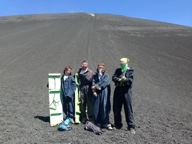 Vanamos gets ready for its run down the volcano. That plume of smoke you see behind us is another daring soul making his run. The photo does not do justice to the vertical drop of the mountain.