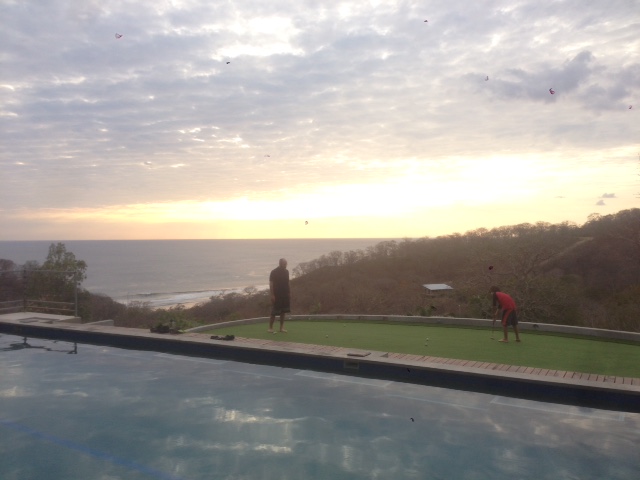 J and I are too busy on the putting green fronting the pool at HulaKai Hotel to bother with the view.