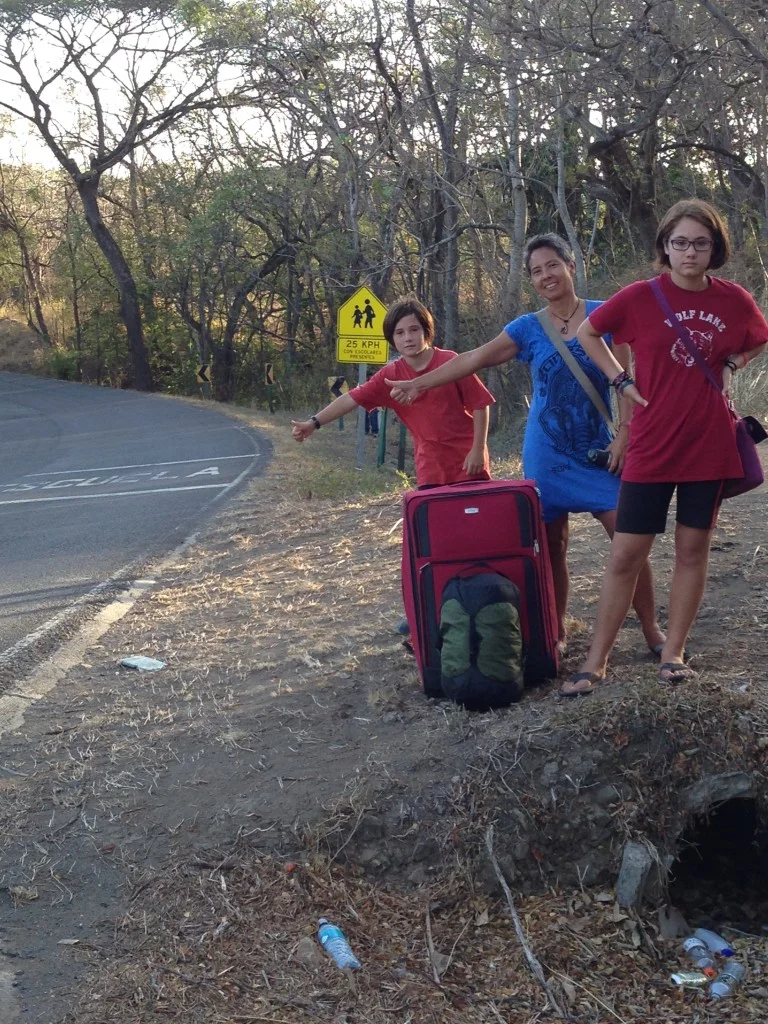Here we are clowning around while we wait for the bus.