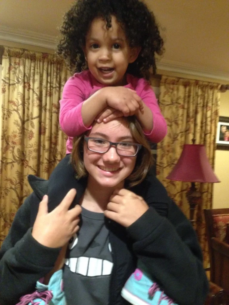 Coconut holding one of her other cousins.
