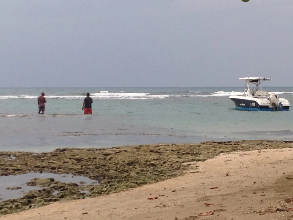 Locals try their hand at catching dinner at the end of a hot day.