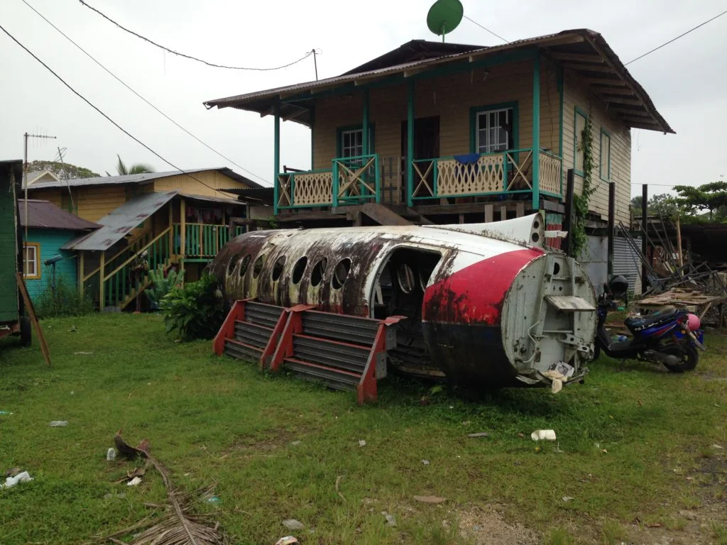 We couldn't tell if this airplane part in the front yard was used for storage or as Grandpa's house.