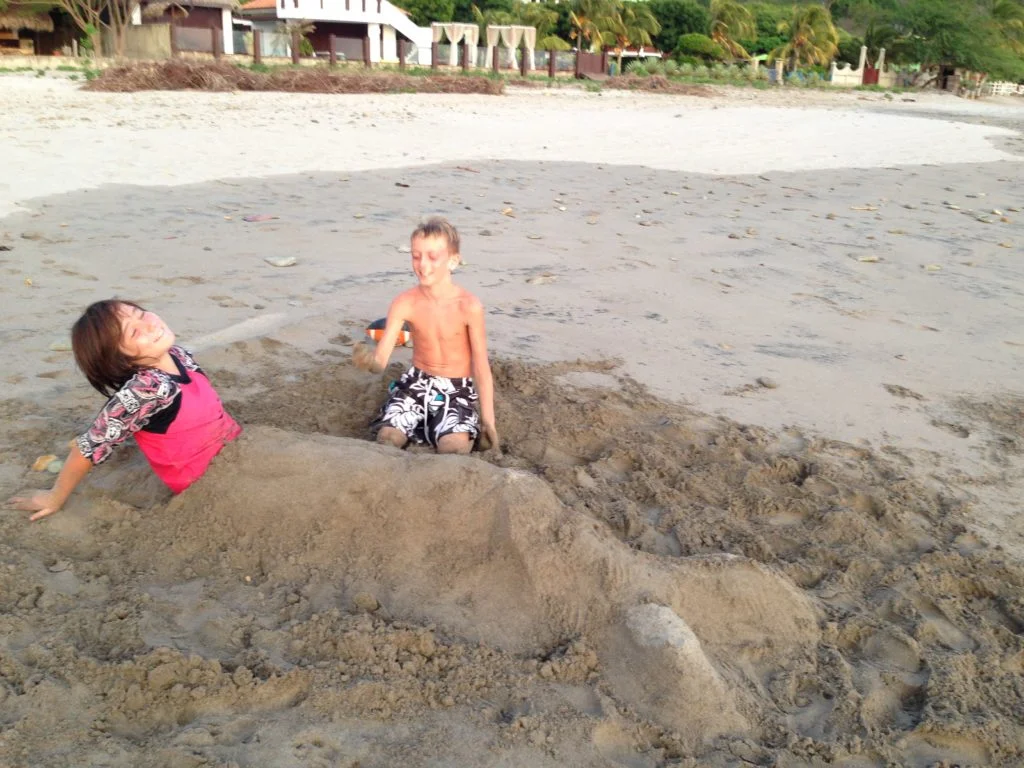 J and Owen clowning around on Playa Marsella.