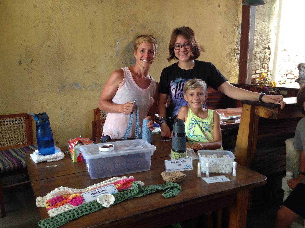 Selling hippie products at the farmers market.