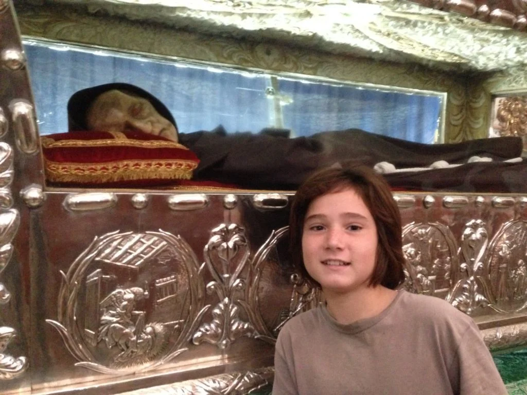 J poses with the mummified remains of Sebastian de Aparicio, the protector of conducirs.