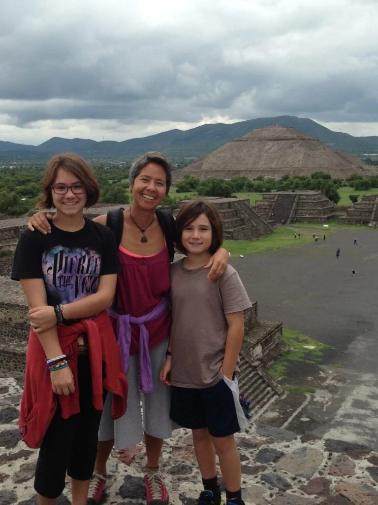 R is flanked by Coconut and J atop the Pyramid of the Moon with the massive Pyramid of the Sun poised in the background