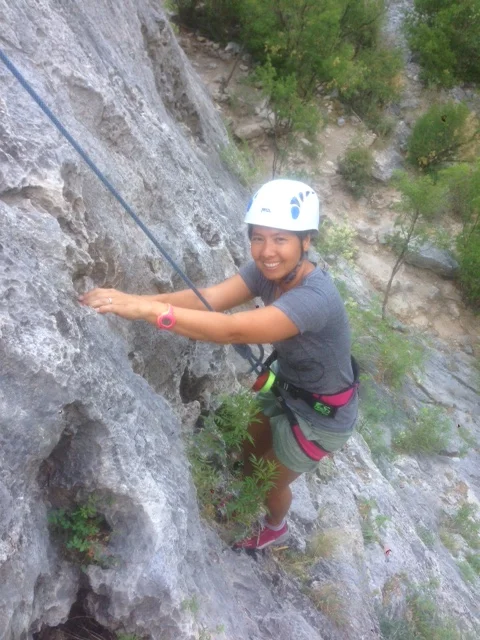 R prefers alternative forms of exercise to sit-ups and push-ups. Here, she is rock climbing in El Potrero Chico in northern Mexico.