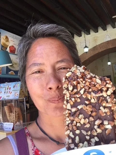 R, living the dream with a nut and chocolate covered ice cream bar.
