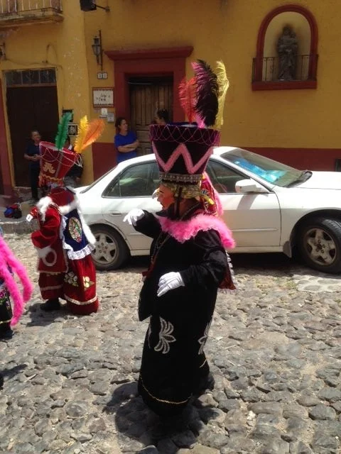 These costumes seemed to be a cross between the three wise men, representing the Catholic faith, and the feathered gods favored by the Aztec. Or it could have just been totally random.