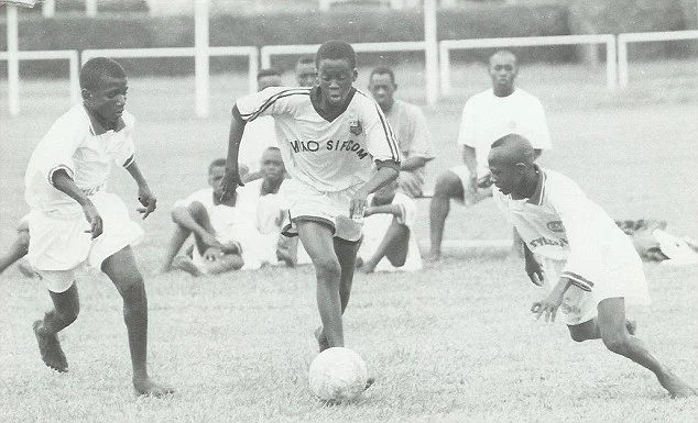 Yaya Toure (centre) playing youth football in the Ivory Coast