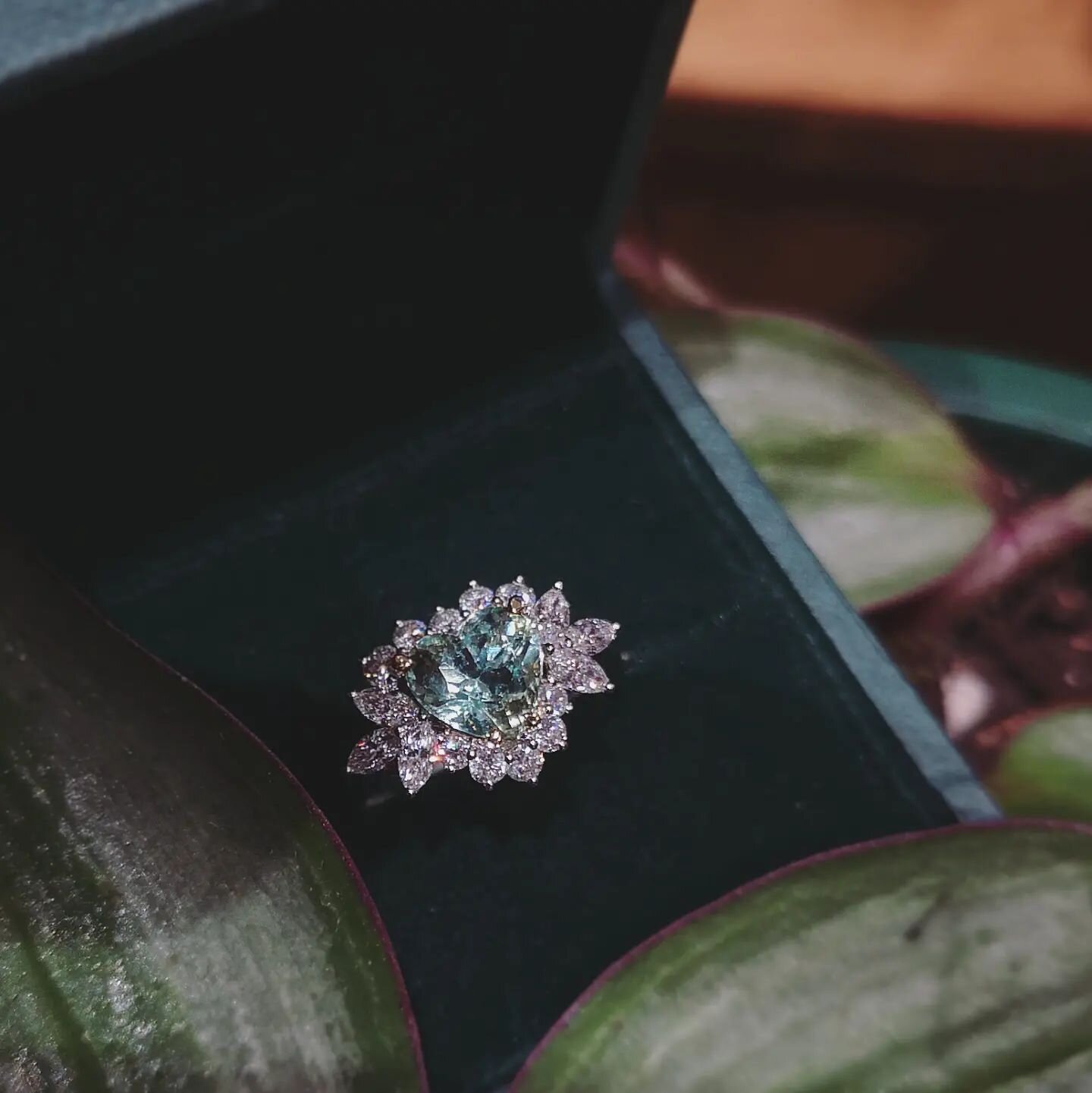 Come in store and try on this stunning new design, consists of a 1.61ct heart shape, green Beryl. Surrounded by marquise and round brilliant diamonds, set in 18ct white gold.