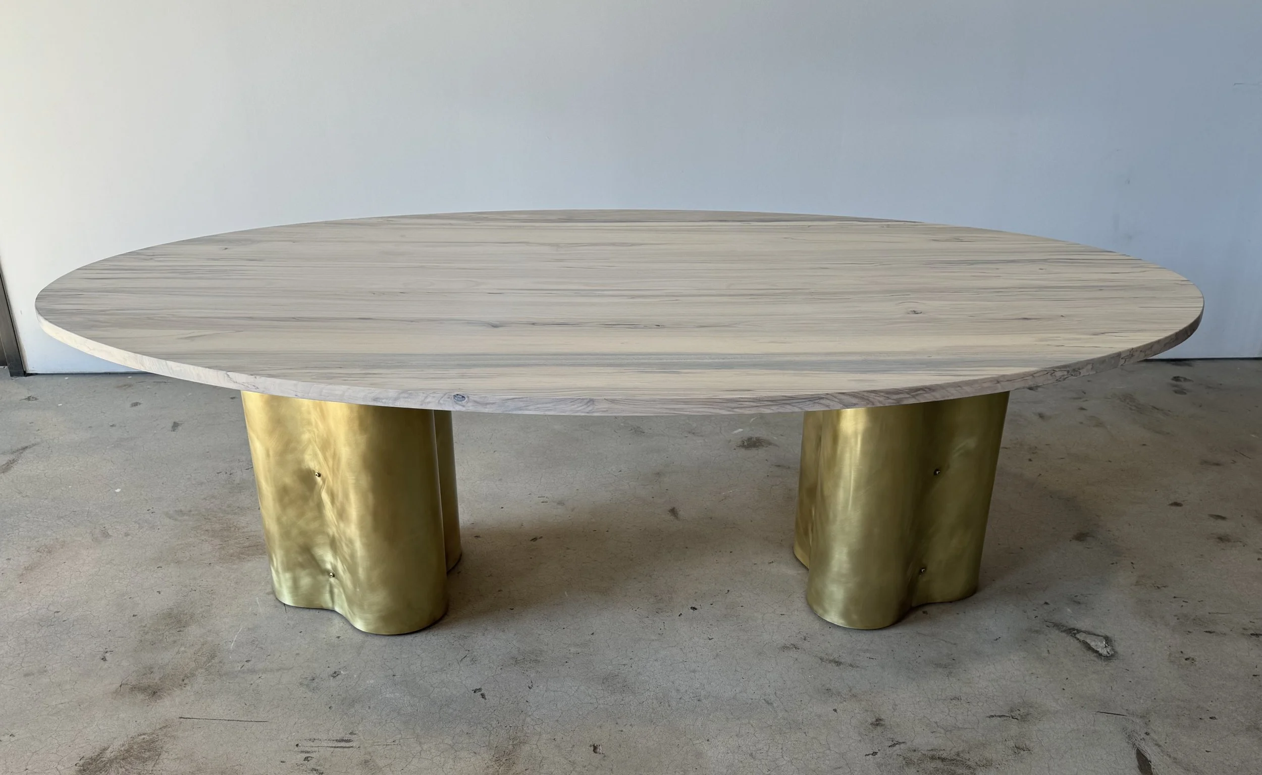 Spalted hackberry oval with burnished brass wrapped bases