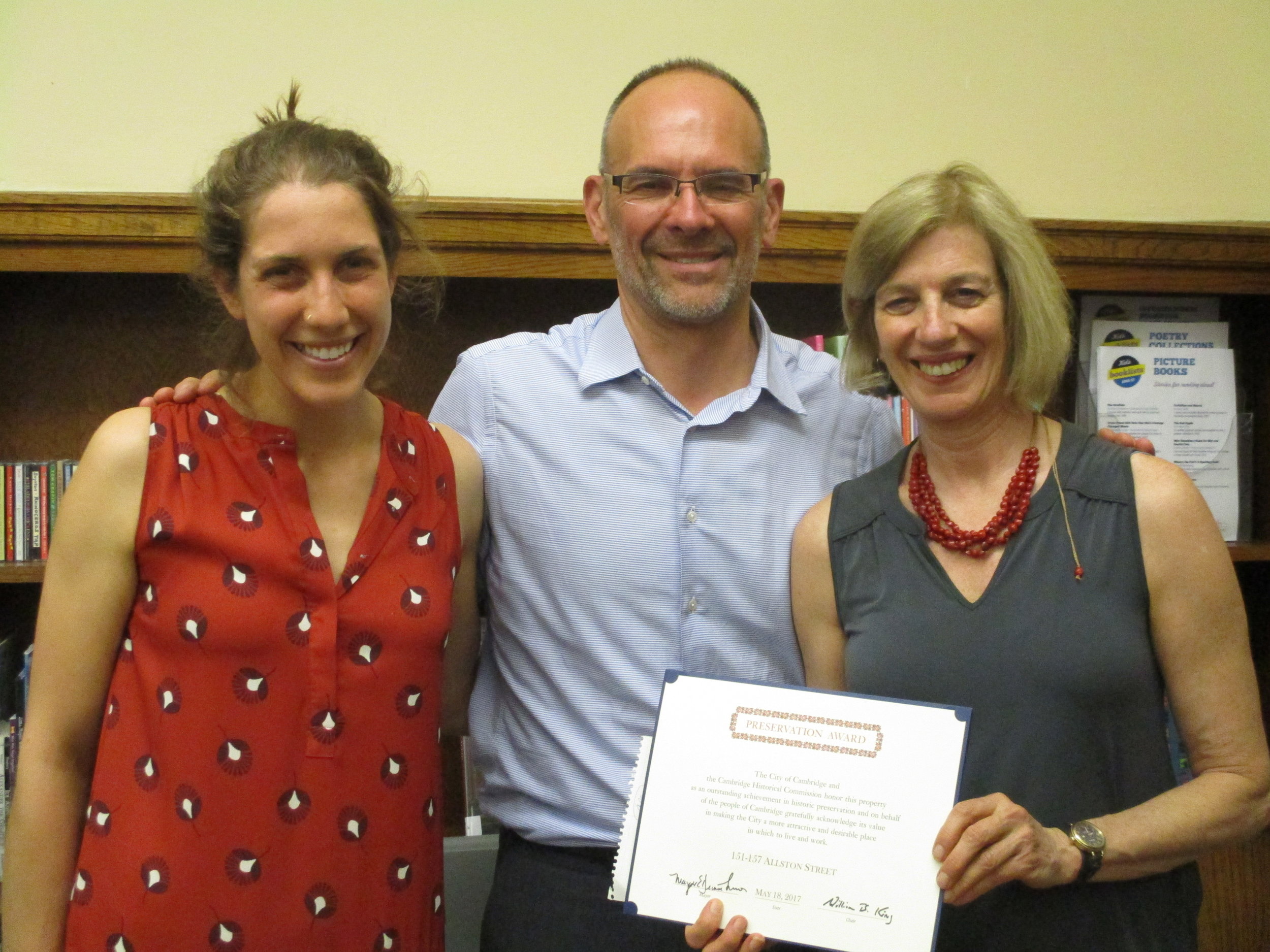 Rebecca Schofield (HRI), David Flaschenriem (TNG), and Jane Carbone (HRI) accept the Preservation Award for 151-157 Allston Street.