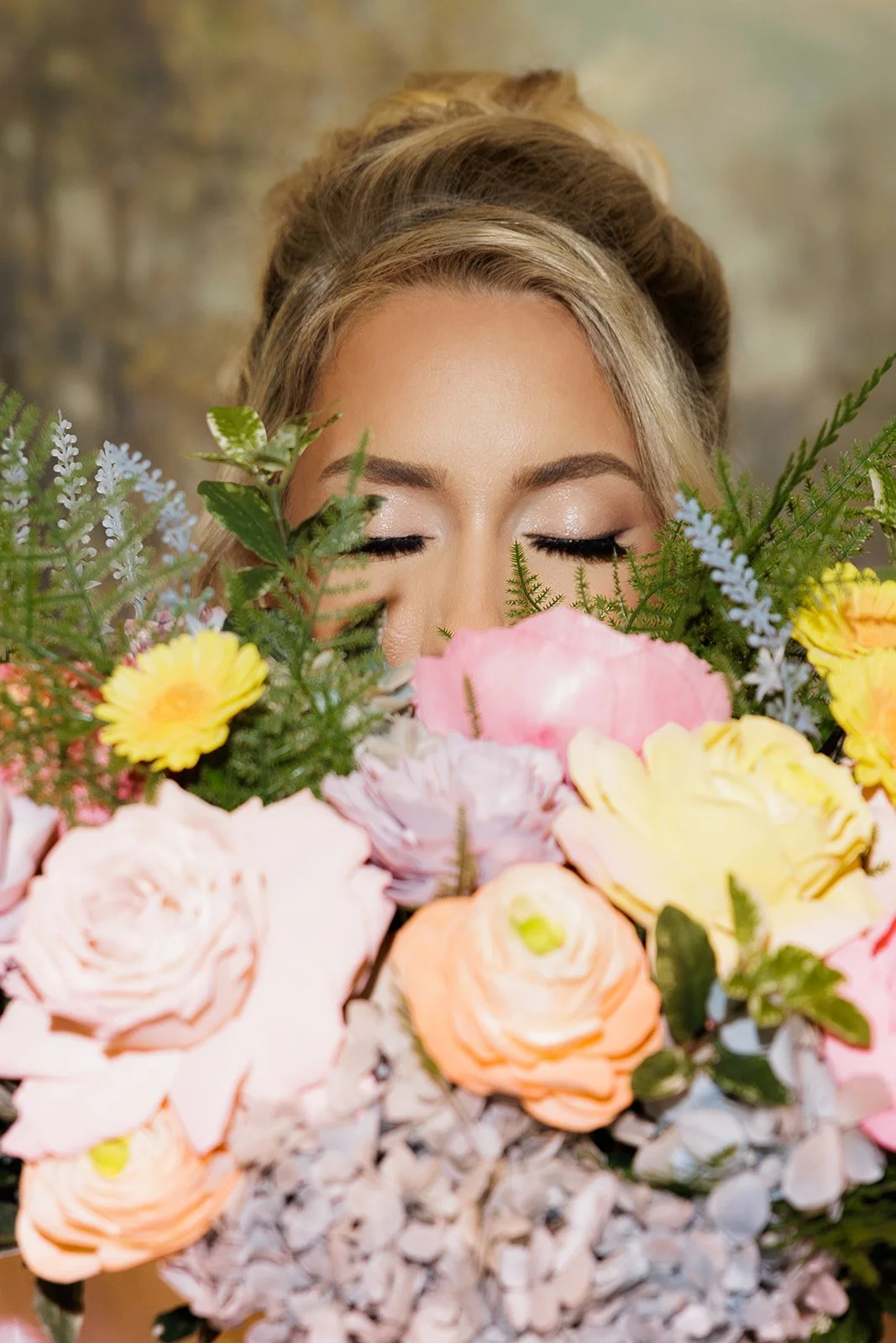 Bride with soft romantic bridal makeup and elegant updo hairstyle by Sarah Elizabeth Artistry