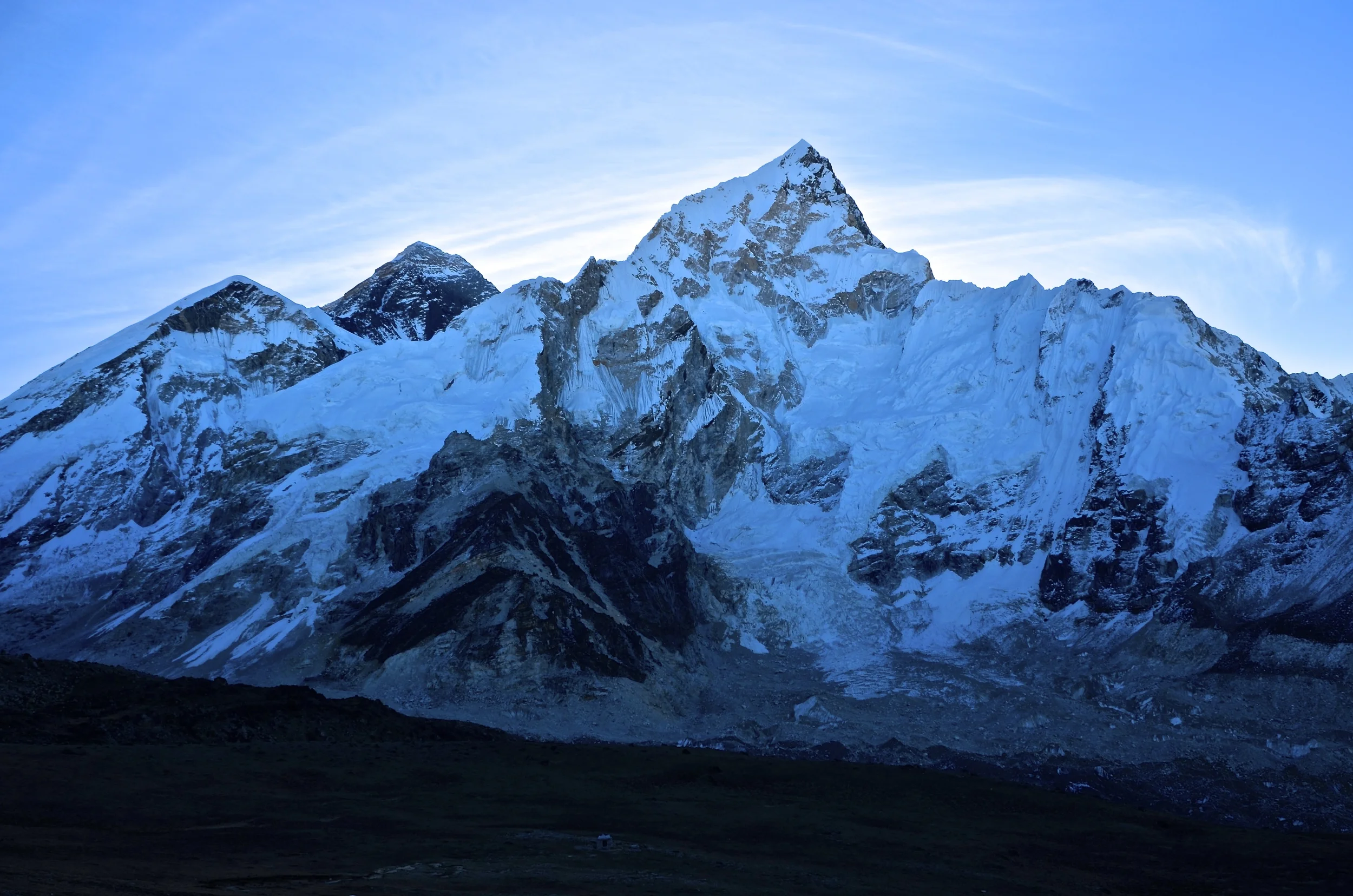Everest peeking behind Lhotse at dawn.