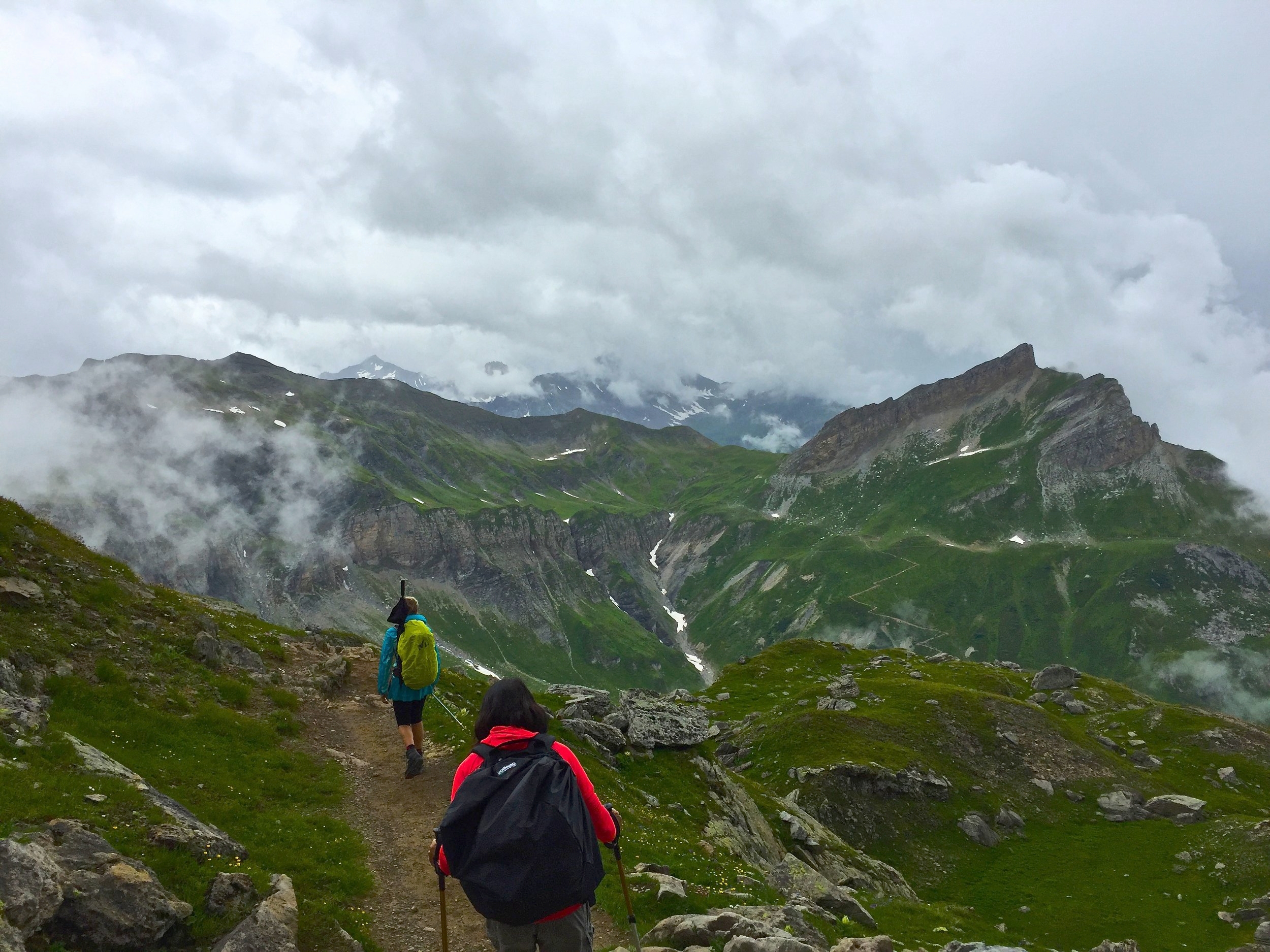 Hiking past Col du Bonhomme we find ourselves in and above the clouds.