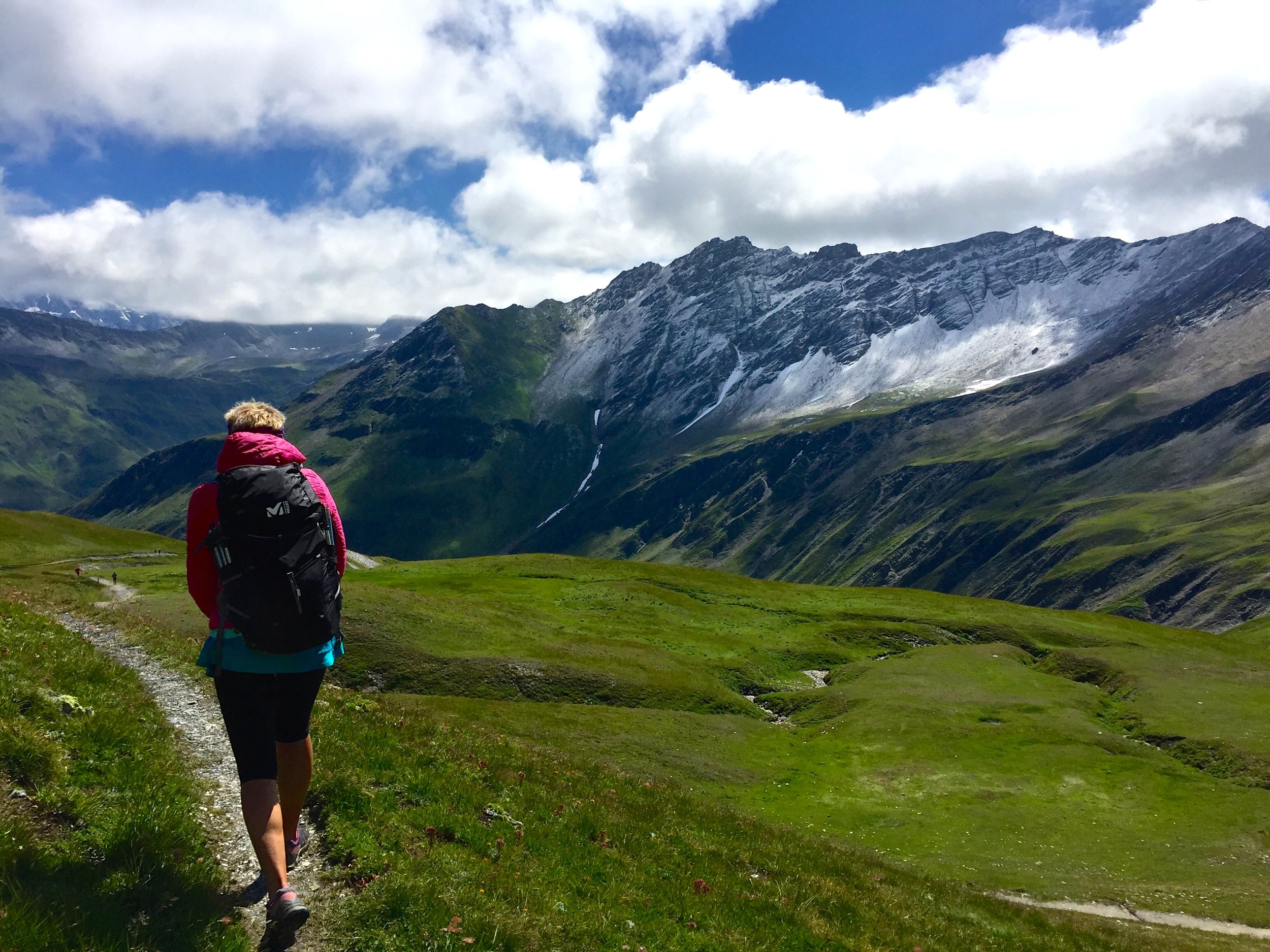 Hiking down into Switzerland, one of three countries you'll trek through on the Tour du Mont Blanc.